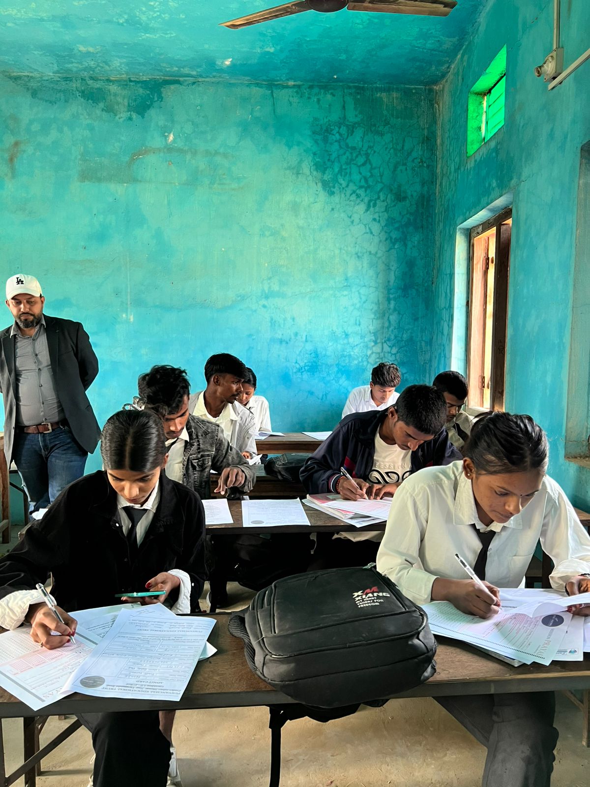Students filling out Purvanchal Educational Trust scholarship admit-card forms