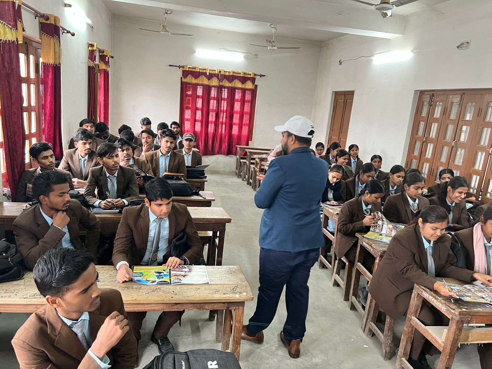 Career counseling session with a large classroom of uniformed students